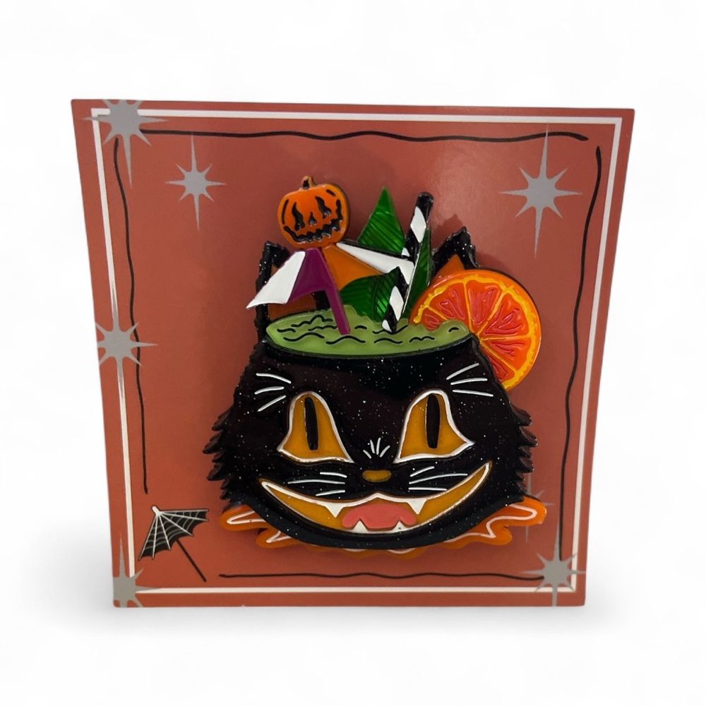 “Black Magic Halloween Tiki” brooch by artist Carrie Hudson ,Lipstick & Chrome